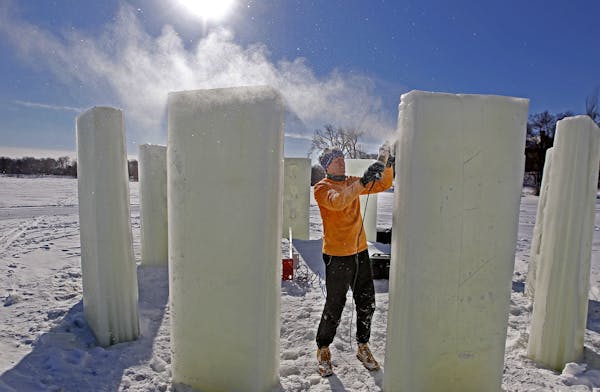 Erik Wardenaar, cq, worked on creating "Icehenge" for the annual City of Lakes Loppet Festival at Lake of the Isles, Friday, January 31, 2014 in Minne