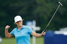 Mel Reid, of England, reacts after making her birdie putt on the 18th green during the final round of the KPMG Women's PGA Championship golf tournamen