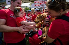 Nurse Jeff Bluem brought his daughter Kaylee to the picket at M Health Fairview’s Southdale Hospital in Edina, where they met Hannah Dolby and her d