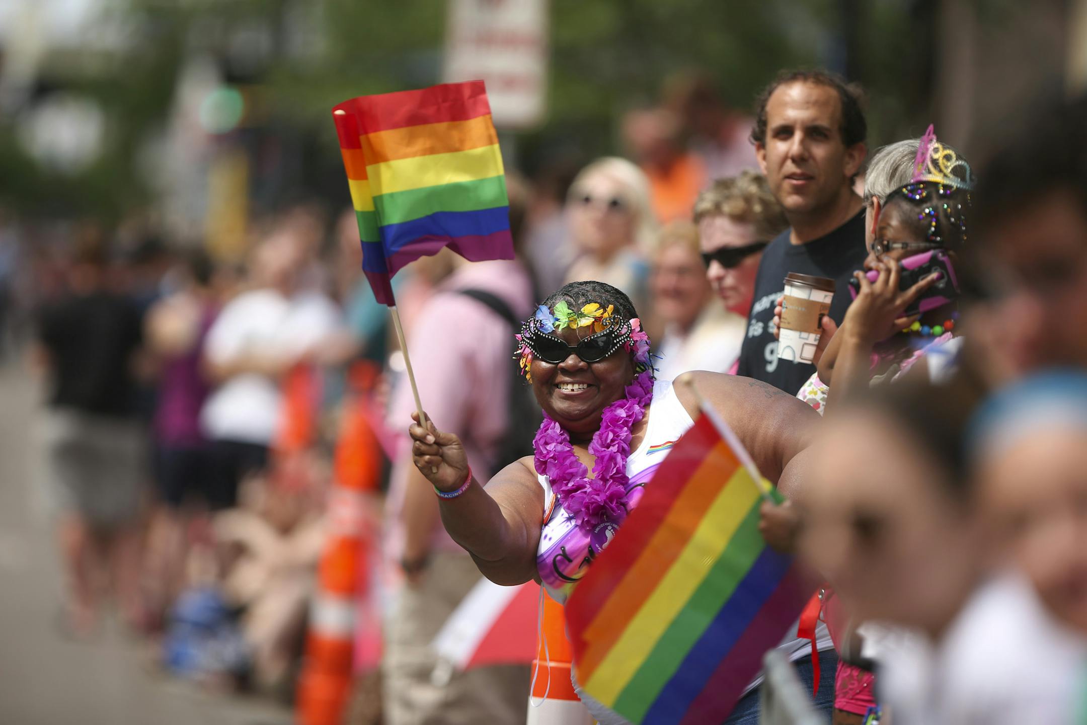 The crowd along the Hennepin Avenue parade route cheered as the color guard signaled the beginning of the parade Sunday.