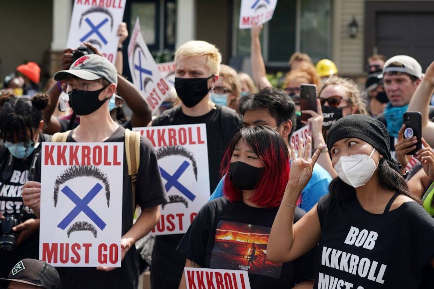 More than 100 Black Lives Matter protesters rallied outside the home of Minneapolis Police Federation president Bob Kroll and his wife WCCO reporter Liz Collins in a continued effort to get them both fired from their jobs Saturday.