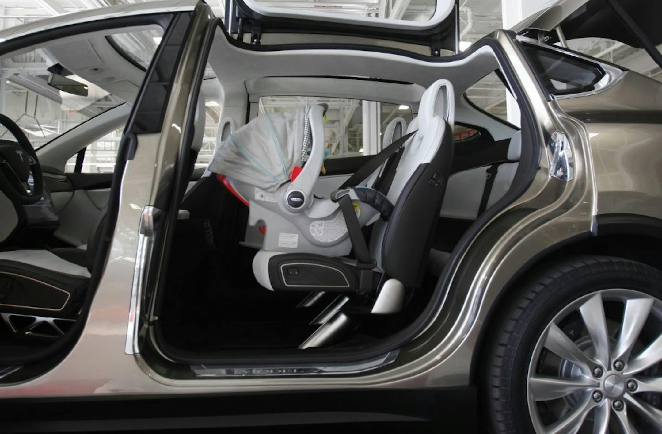 An infant car seat in the beta version of the Tesla Model X -- a 7 passenger SUV at Tesla's Factory in Fremont, California, on Thursday, February 23, 2012. The company is marketing the car to women.
