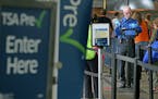 Passengers make their way through the TSA PreCheck area at Terminal 1 at Minneapolis-St. Paul International Airport.