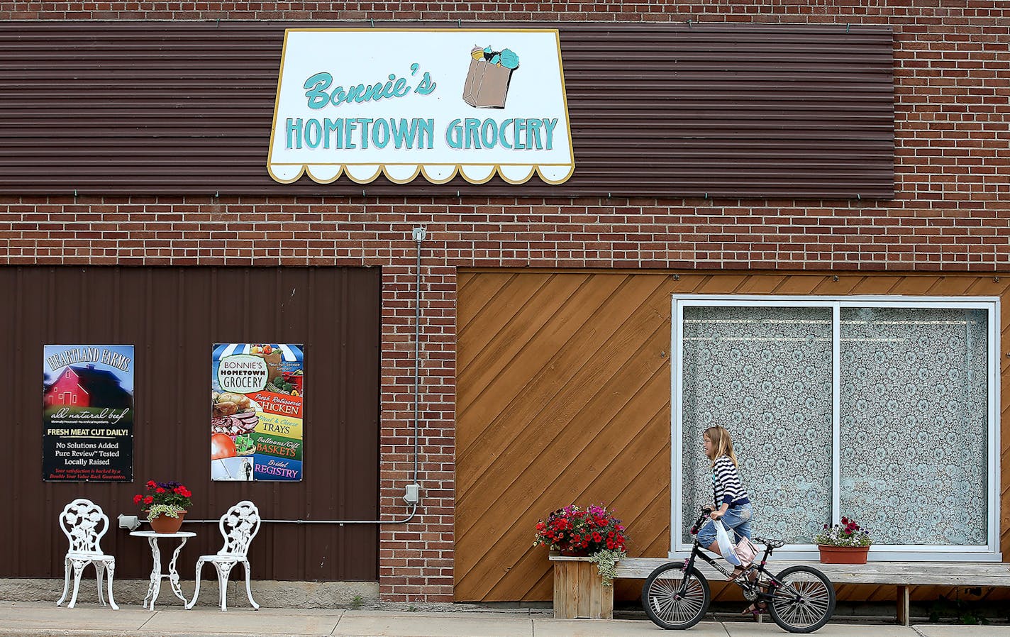 Hannah Thorson made her way home after a morning grocery run to Bonnie's Hometown Grocery via bicycle, Wednesday, June 24, 2015. ] (ELIZABETH FLORES/STAR TRIBUNE) ELIZABETH FLORES &#x2022; eflores@startribune.com