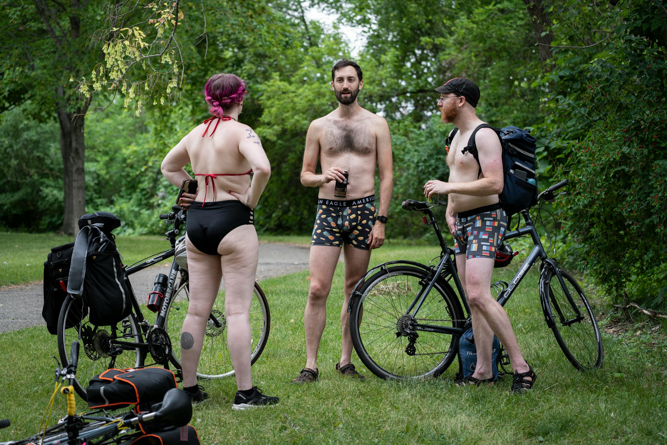 Three bicyclists wait for the annual Freedom From Pants Ride to start.
