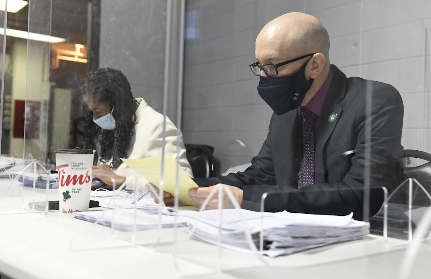 Wayne County Director of Elections Director Greg Mahar, right, gives the elections report to the Wayne County Board of Canvassers as Wayne County corporation counsel Janet Anderson-Davis, left, listens during a board meeting in Detroit on Tuesday, Nov. 17, 2020. On Thursday, Nov. 19, 2020, state officials said Wayne County, Michigan's largest county, cannot revoke its certification of election results after two Republicans who approved Democratic candidate Joe Biden's local landslide wanted to r