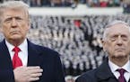 FILE-- President Donald Trump and Defense Secretary Jim Mattis at the annual Army-Navy Collegiate football game at Lincoln Financial Field in Philadel