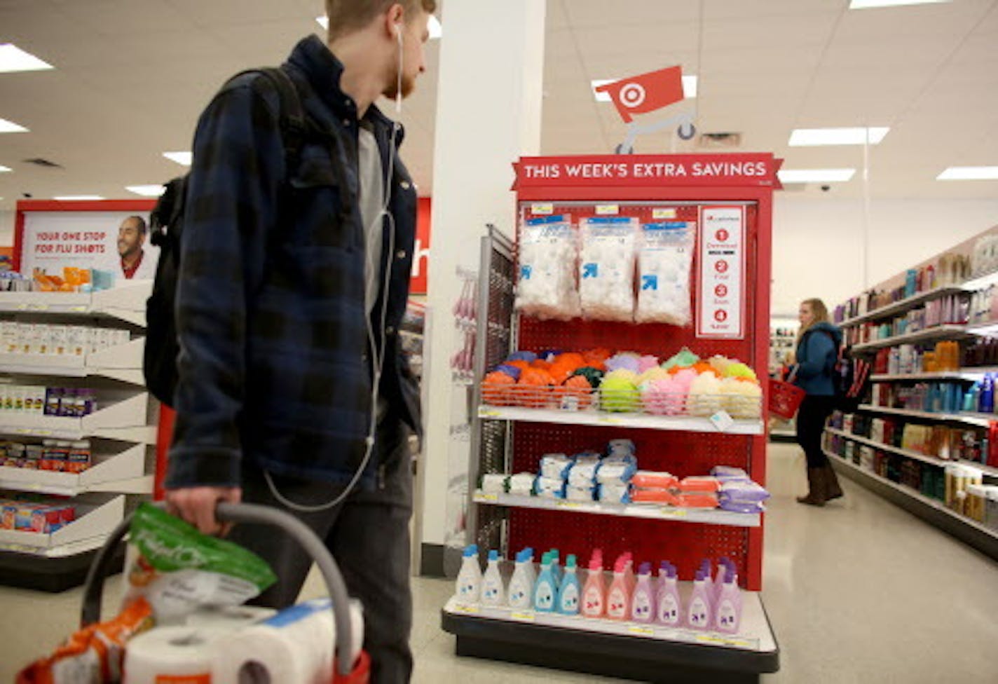 A customer went by a display for the cartwheel app at the Target Express in Dinkytown. ] (KYNDELL HARKNESS/STAR TRIBUNE) kyndell.harkness@startribune.com At two different Target Stores. One in the Quarry and the second is at the Target Express in Dinkytown in Minneapolis, Min., Wednesday, February 4, 2015.