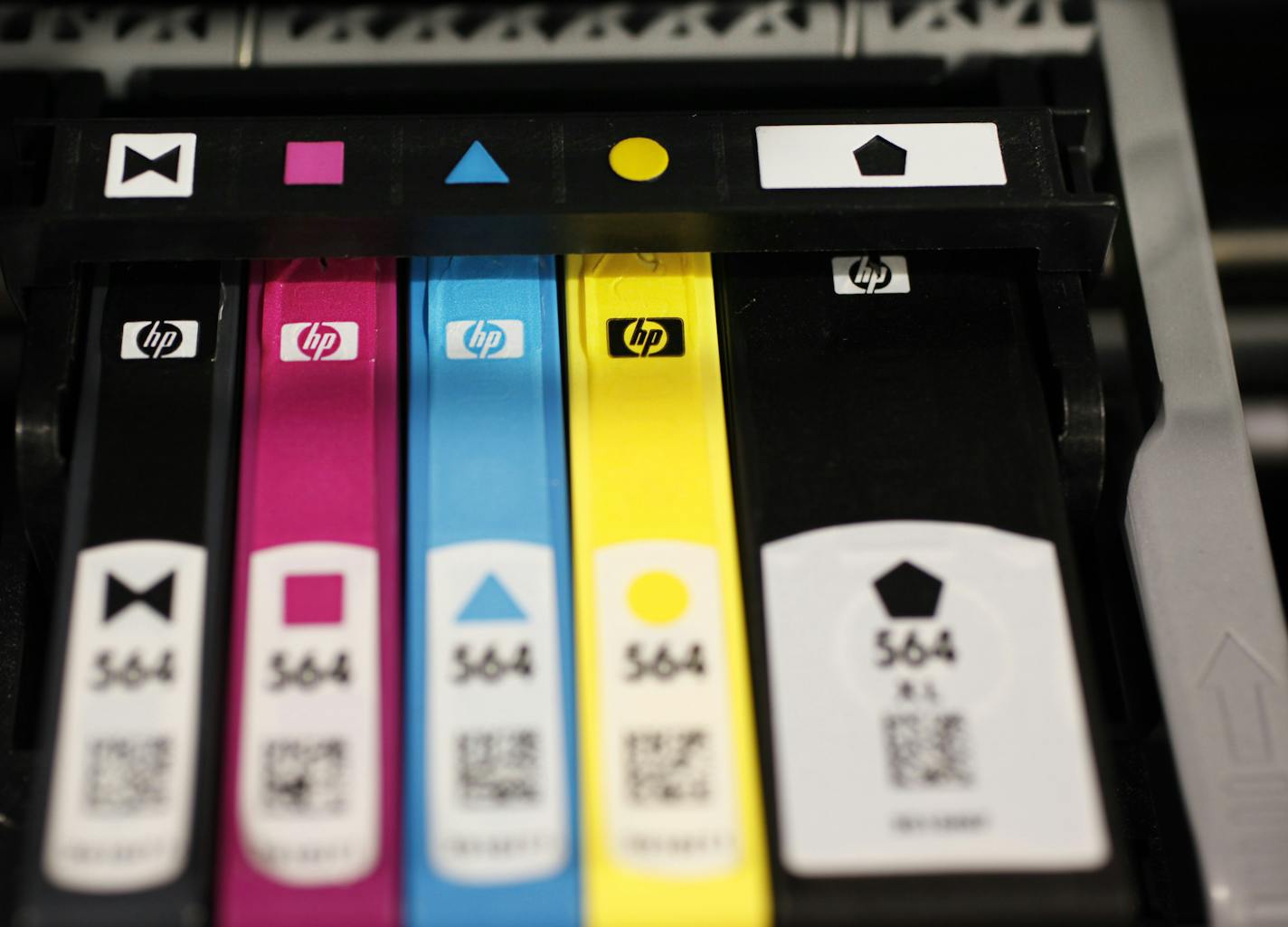 Hewlett Packard printer inks are seen inside an HP printer on display at Best Buy in Mountain View, Calif., Monday, May 18, 2009. Hewlett-Packard Co. on Tuesday said its quarterly profit dropped 17 percent as sales of personal computers and printer ink slumped. The numbers were still in line with Wall Street's forecasts. (AP Photo/Paul Sakuma) ORG XMIT: CAPS117