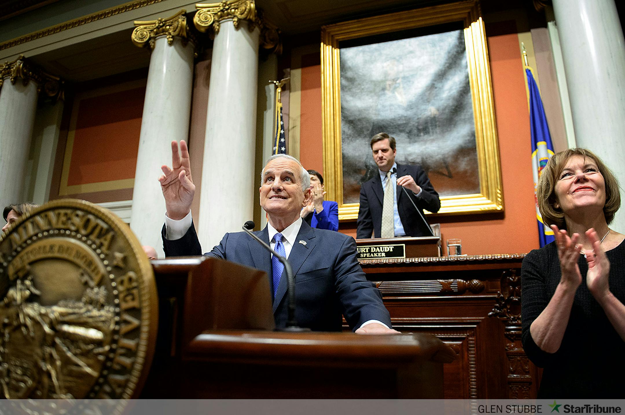 Governor Mark Dayton received warm applause in the House Chamber as he delivered his 2015 State of the State address at the Minnesota State Capitol, St. Paul. On the right, Lt. Governor Tina Smith.    ] GLEN STUBBE * gstubbe@startribune.com Thursday, April 9, 2015