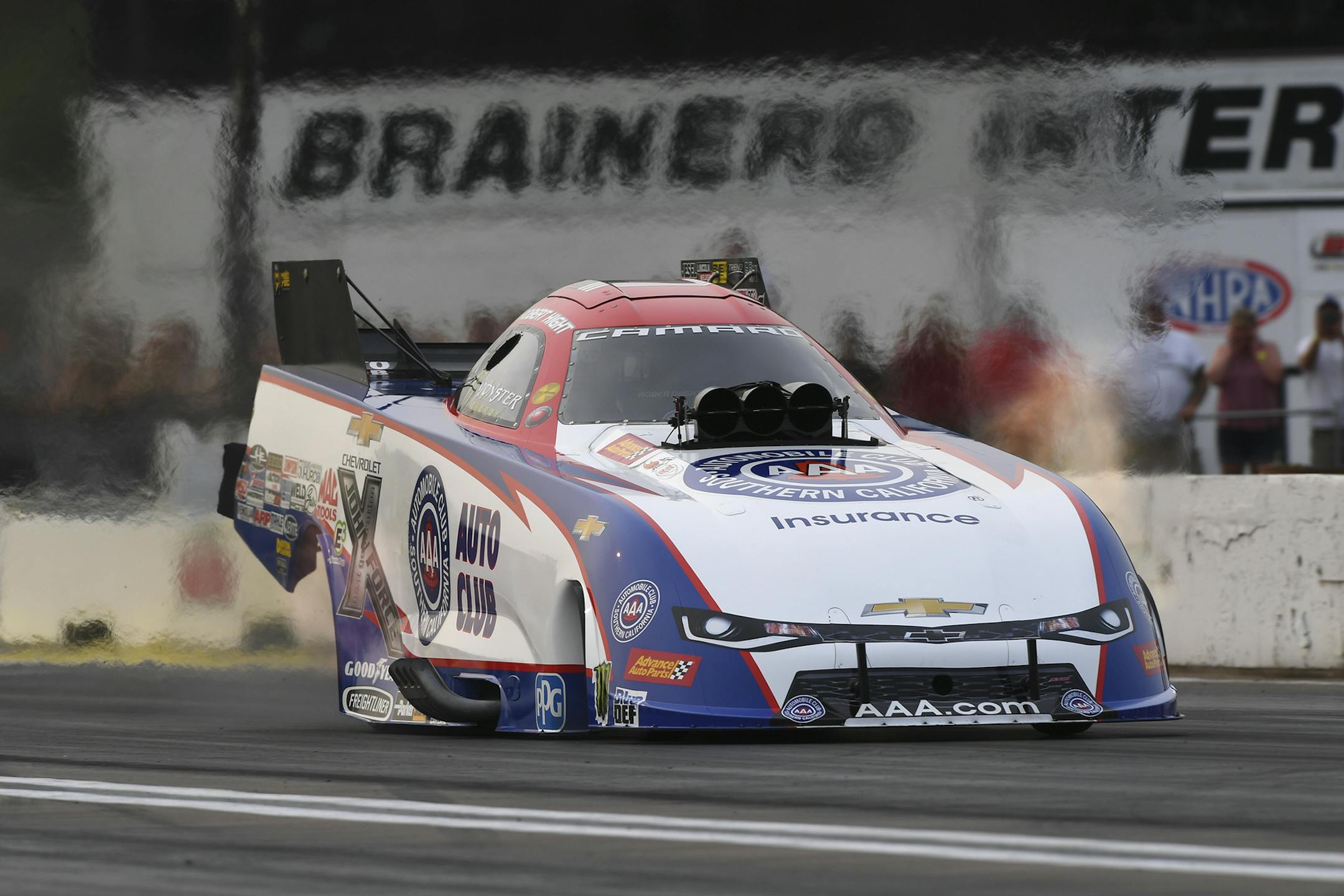 In this photo provided by the NHRA, Robert Hight drives in Funny Car qualifying at the Lucas Oil NHRA Nationals drag races Friday, Aug. 17, 2018, at Brainerd International Raceway in Brainerd, Minn. Hight drove to a 3.971-second pass at 326.95 mph to earn the preliminary No. 1 qualifying position. (Marc Gewertz/NHRA via AP)