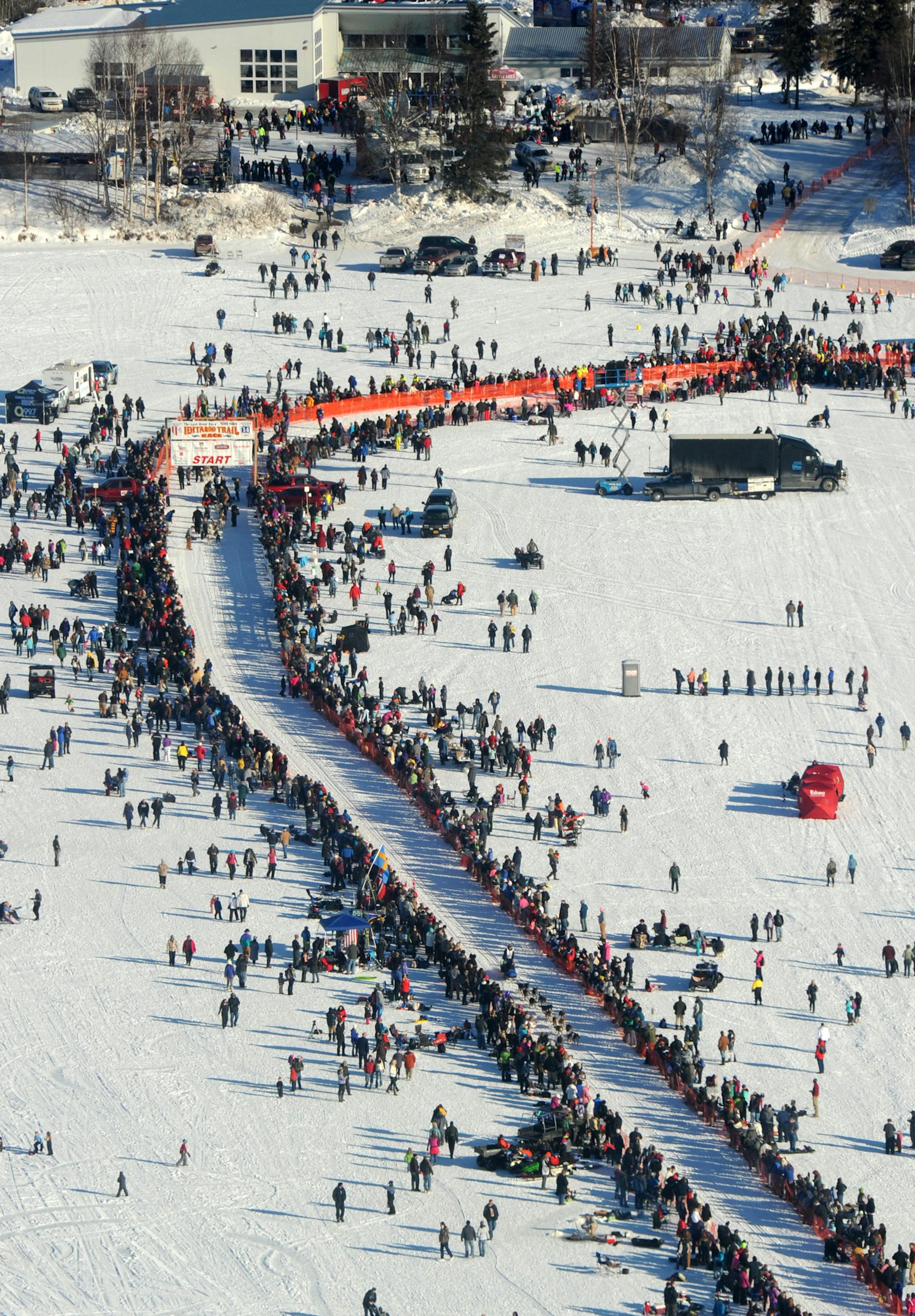 A musher drives his dog team down the chute during the start of the 2014 Iditarod Trail Sled Dog Race in Willow, Alaska, Sunday, March 2, 2014. The race will take mushers nearly a thousand miles to the finish line in Nome, on Alaska's western coast. (AP Photo/Anchorage Daily News, Bob Hallinen)