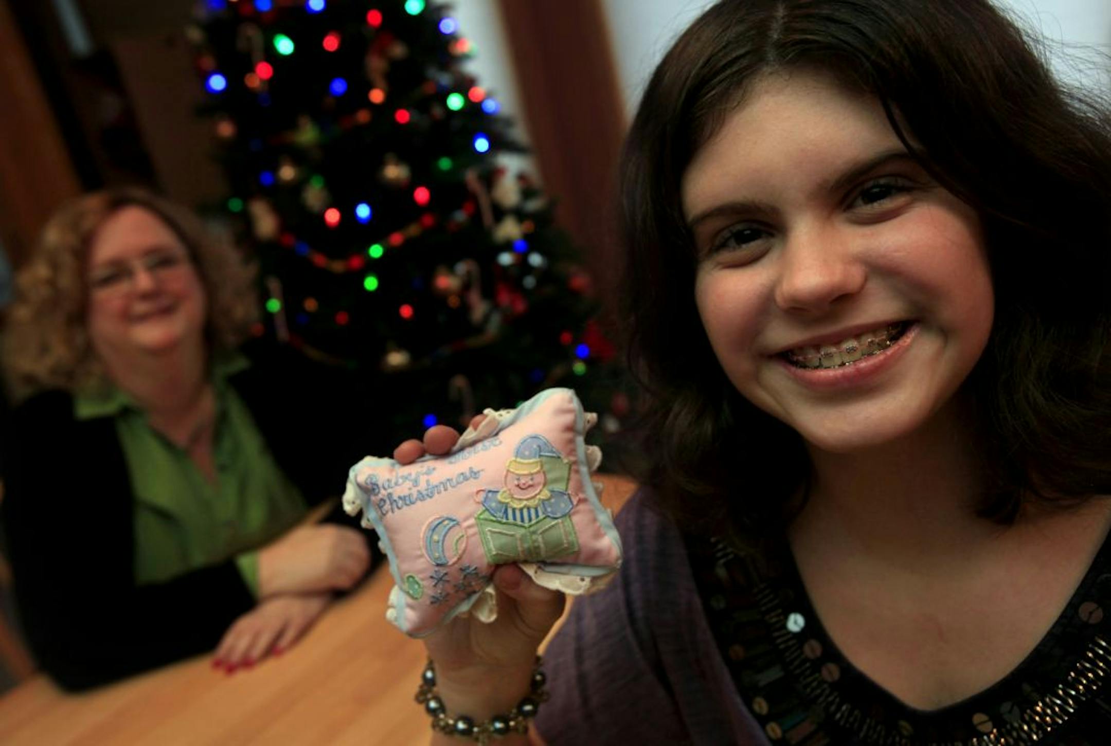 Joan (left) and Anna Hause at home with her ornament in Lake Elmo, MN on December 17, 2012.