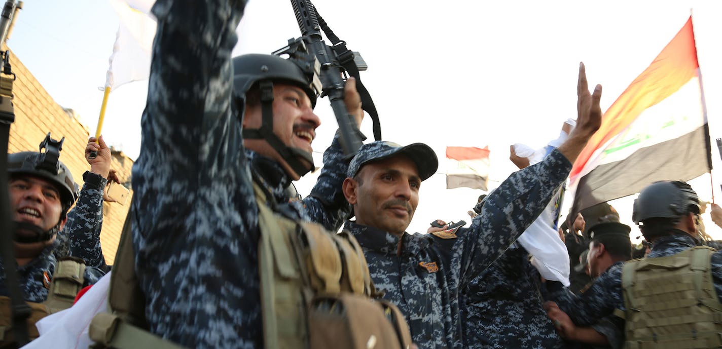 Iraqi soldiers attend a celebration for the liberation of Mosul in Mosul, Iraq, July 10, 2017. Haider al-Abadi on Monday formally declared Mosul liberated from Islamic State (IS) militant group after nine months of fierce fighting to dislodge the extremist militants from their last major stronghold in Iraq. (CKhalil Dawood/Xinhua/Zuma Press/TNS) ORG XMIT: 1206020 ORG XMIT: MIN1707110005213138