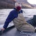 Peter Sorensen sat against the hull of his boat as Jeff Whitty, a research biologist, steered them down the Mississippi River towards their target are