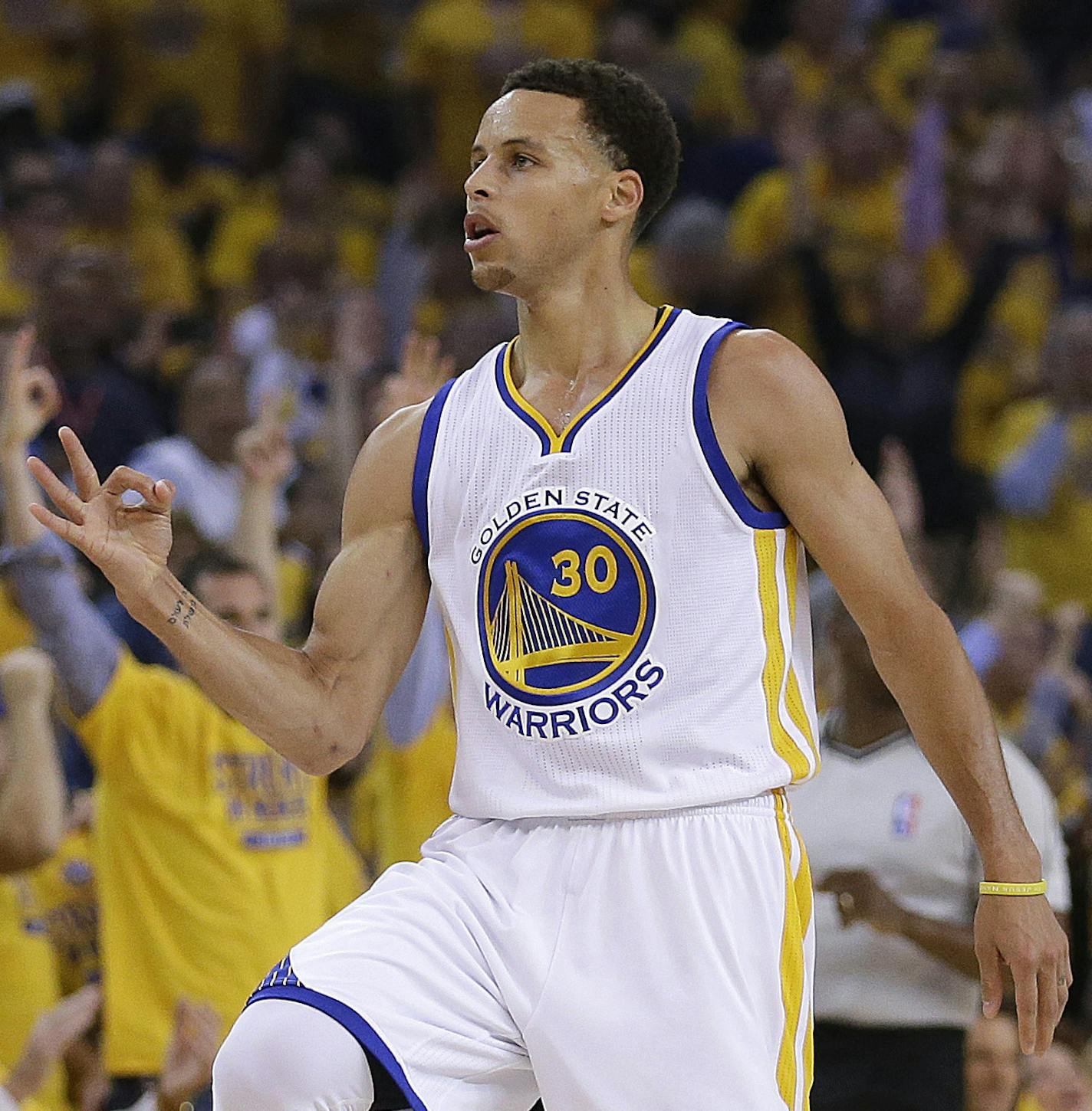 Golden State Warriors' Stephen Curry celebrates after a score during the first quarter of Game 1 of the NBA basketball Western Conference finals against the Houston Rockets Tuesday, May 19, 2015, in Oakland, Calif. (AP Photo/Ben Margot)