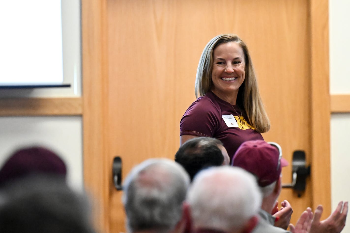 University of Minnesota women's soccer head coach Erin Chastain stands up as she's recognized during the University of Minnesota Coaches Caravan Monday, May 9, 2022 at the Minnesota Landscape Arboretum in Chaska, Minn.. ] AARON LAVINSKY• Aaron.lavinsky@startribune.com