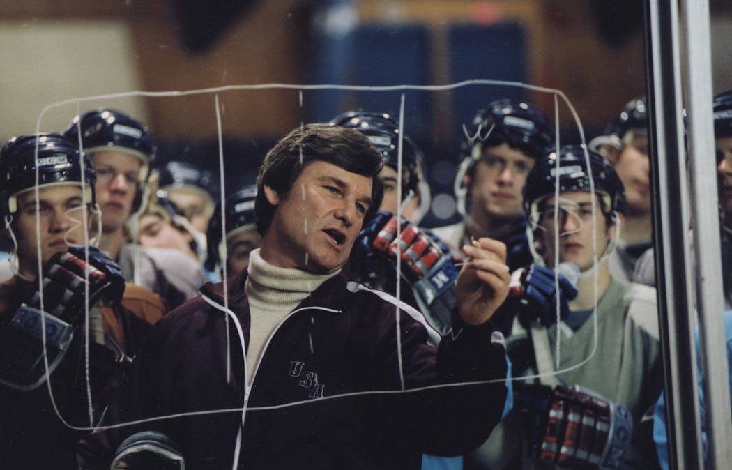 Kurt Russell (center) stars as hockey coach Herb Brooks in the movie “Miracle,” about the 1980 US Olympic team. 