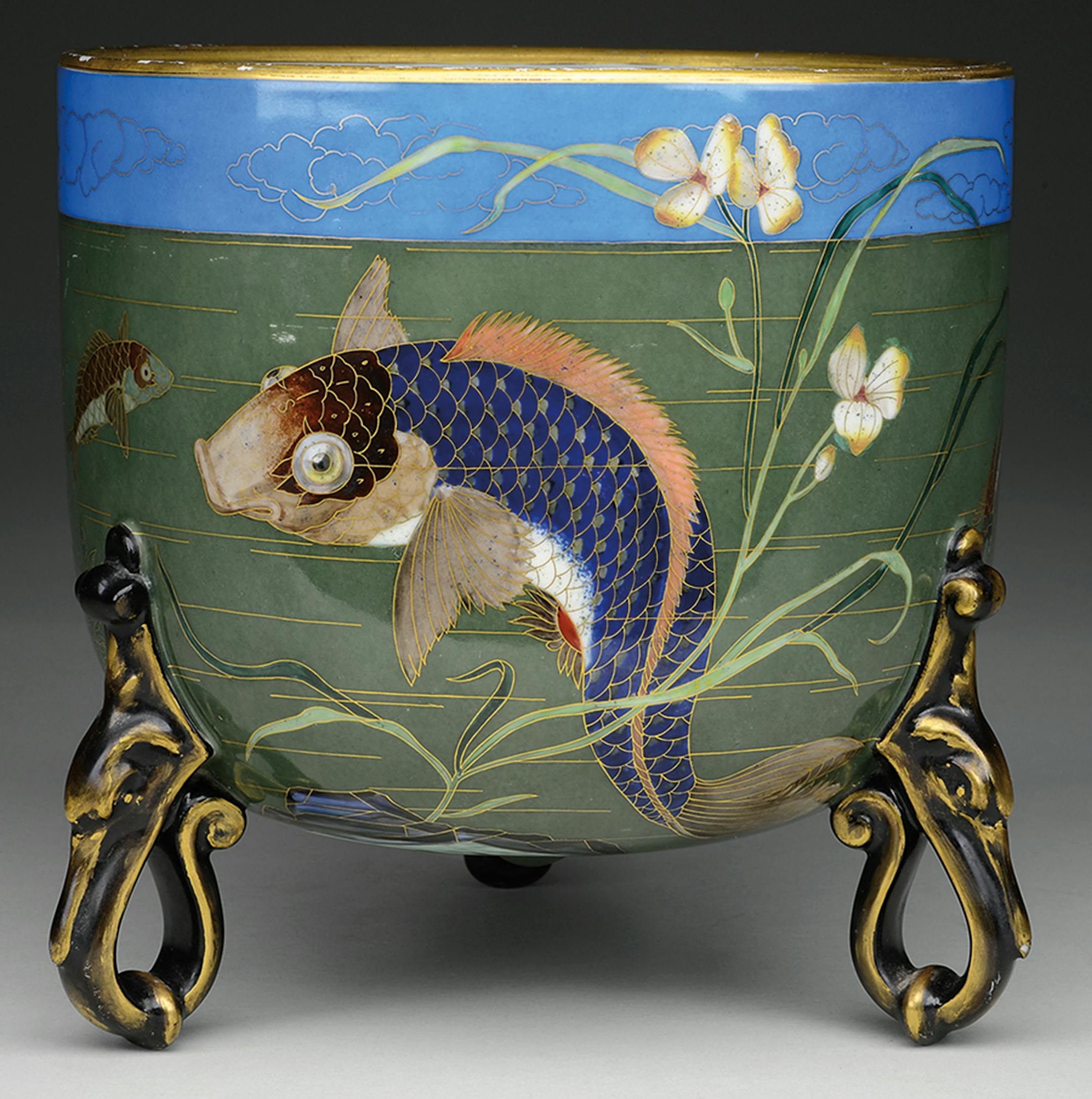 This porcelain &#xec;cachepot&#xee; is 9 inches high. The James Julia auction in Fairfield, Maine., carefully and accurately described it as attributed to Minton with decorations called cloisonne that were used by designer Christopher Dresser at the Minton factory. The piece, unsigned and in fine condition with minor wear on the top edge, sold for $2,370. (c) 2015 by Cowles Syndicate