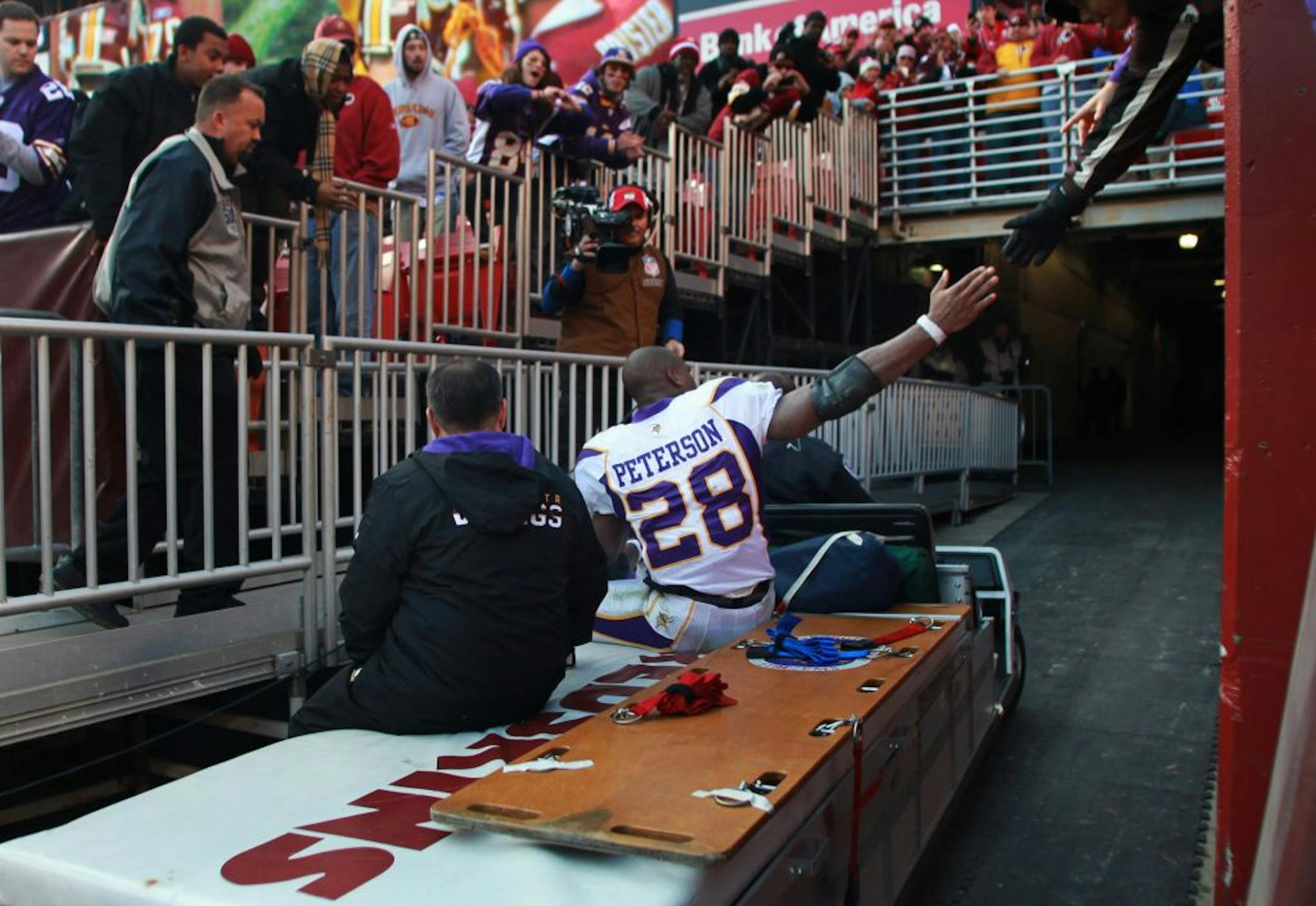 Encouragement came from the stands in FedEx Field as Adrian Peterson was carted to the locker room Saturday because of a left knee injury. X-rays showed no broken bones, but an MRI was to be done Saturday to see whether he has a torn ligament.