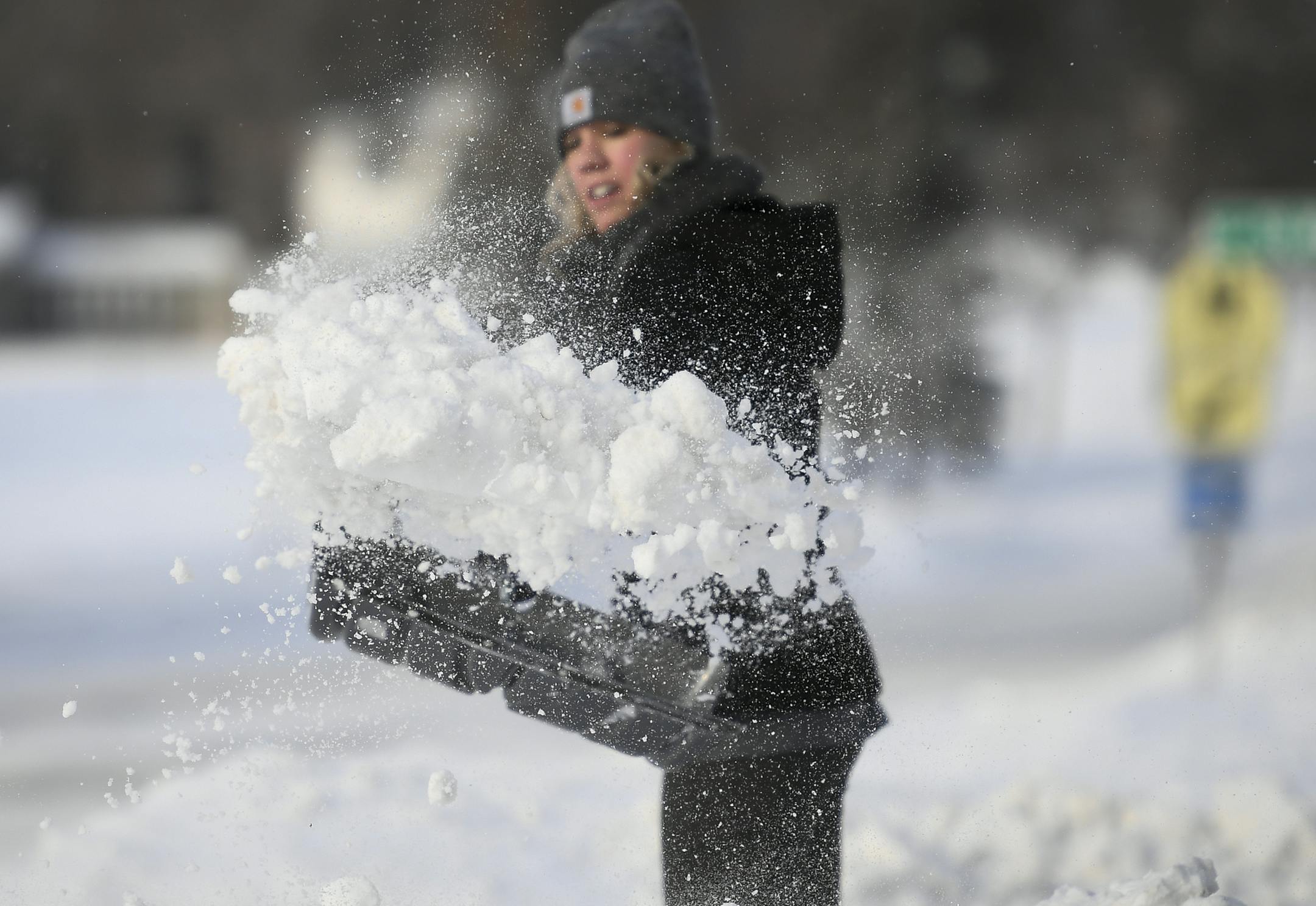 Sydney Winters shoveled her driveway in Golden Valley following the overnight snowfall. ] Aaron Lavinsky • aaron.lavinsky@startribune.com Snow storm photos taken Saturday, Jan. 18, 2020 in Golden Valley, Minnesota.