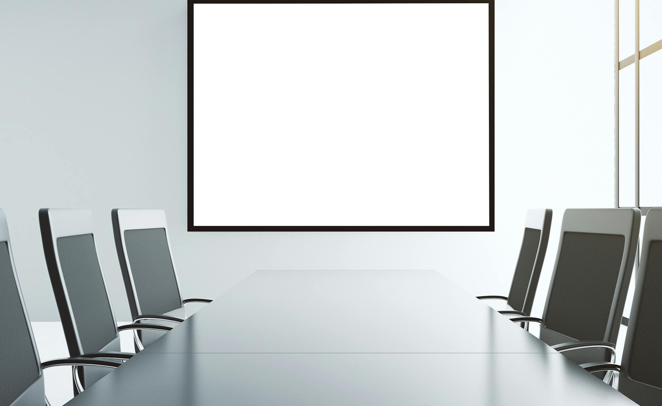 Blank white picture frame on the wall of conference room with furniture, mock up
