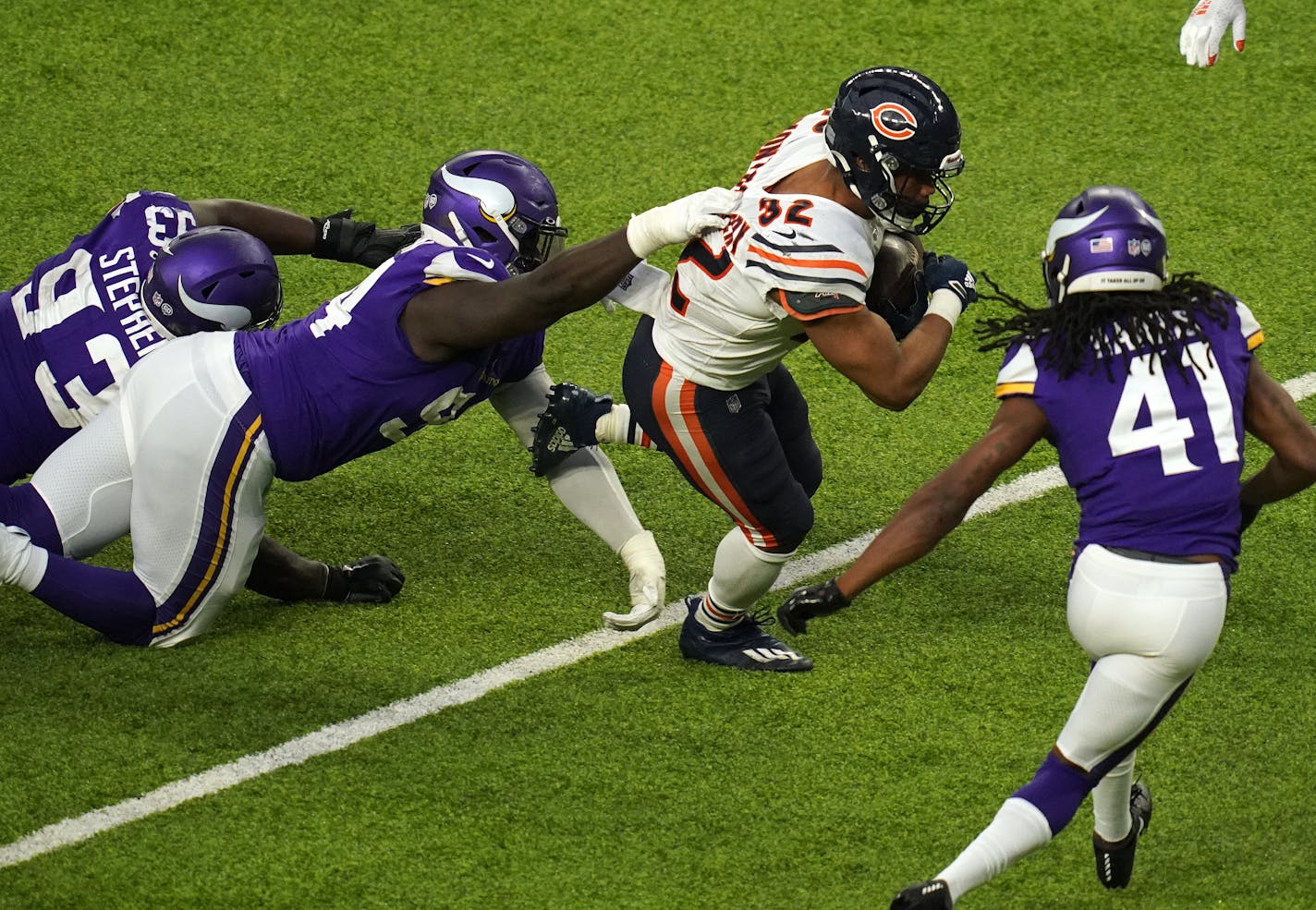 Vikings defensive tackle Jaleel Johnson got a hand on Bears running back David Montgomery as he rushed the ball in the fourth quarter.