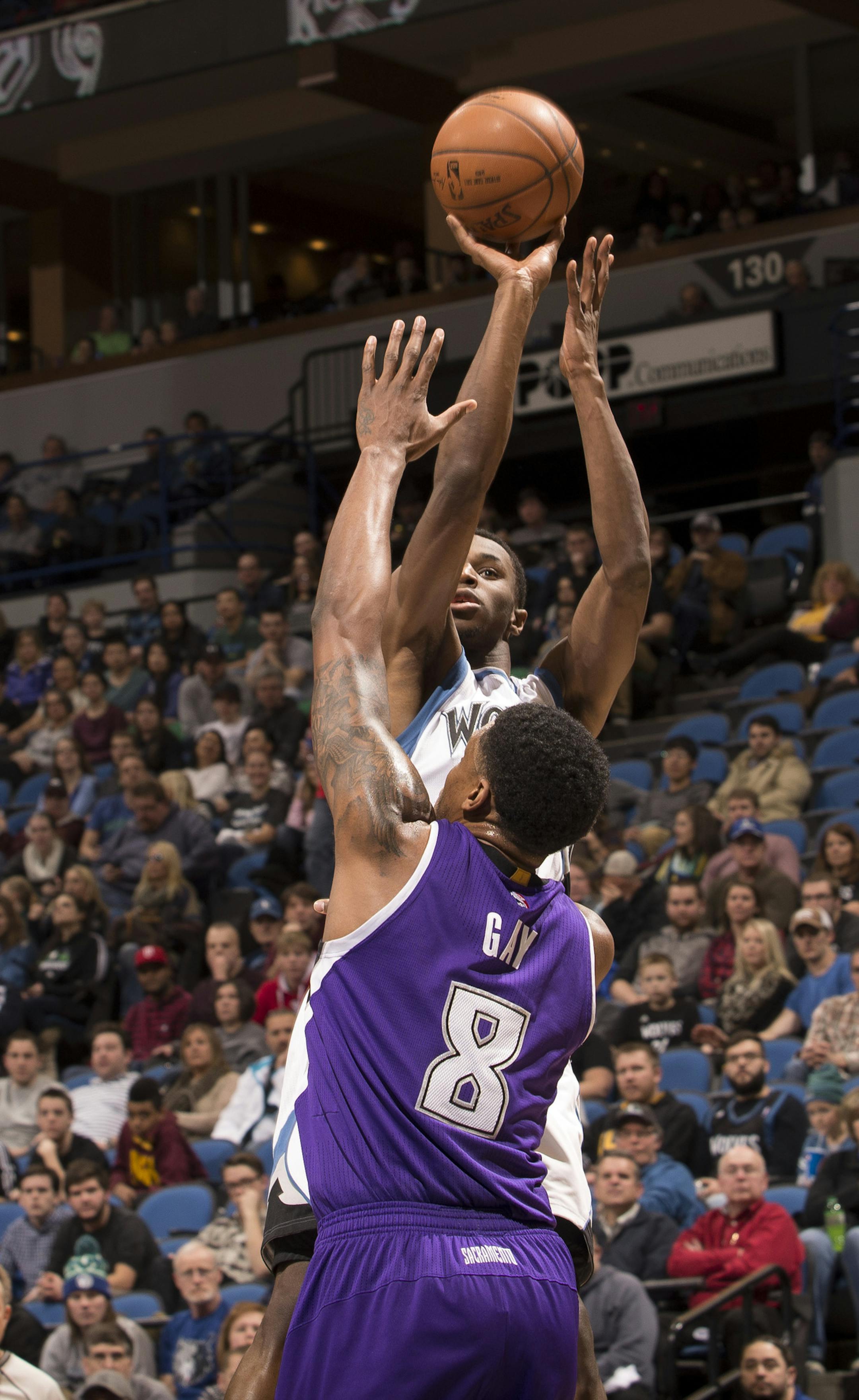 Minnesota Timberwolves forward Andrew Wiggins (22) hits a shot over Sacramento Kings forward Rudy Gay (8) during the second quarter. ] (Aaron Lavinsky | StarTribune) The Minnesota Timberwolves played the Sacramento Kings Thursday, Jan. 1, 2015 at Target Center in Minneapolis.