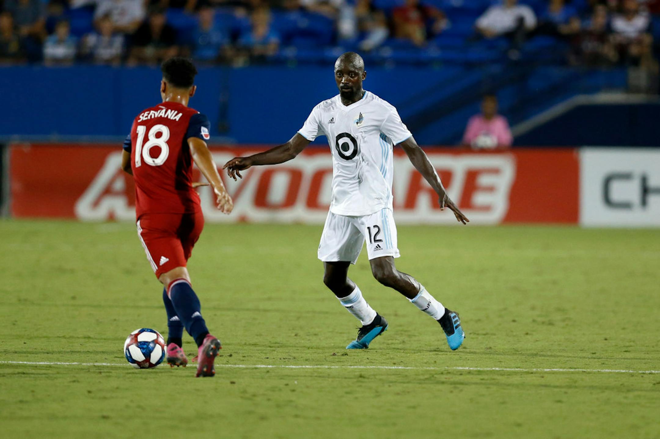 Minnesota United defender Lawrence Olum (right) defended as FC Dallas midfielder Brandon Servania tried to advance the ball during the second half of the teams' match on Aug. 10 in Frisco, Texas.