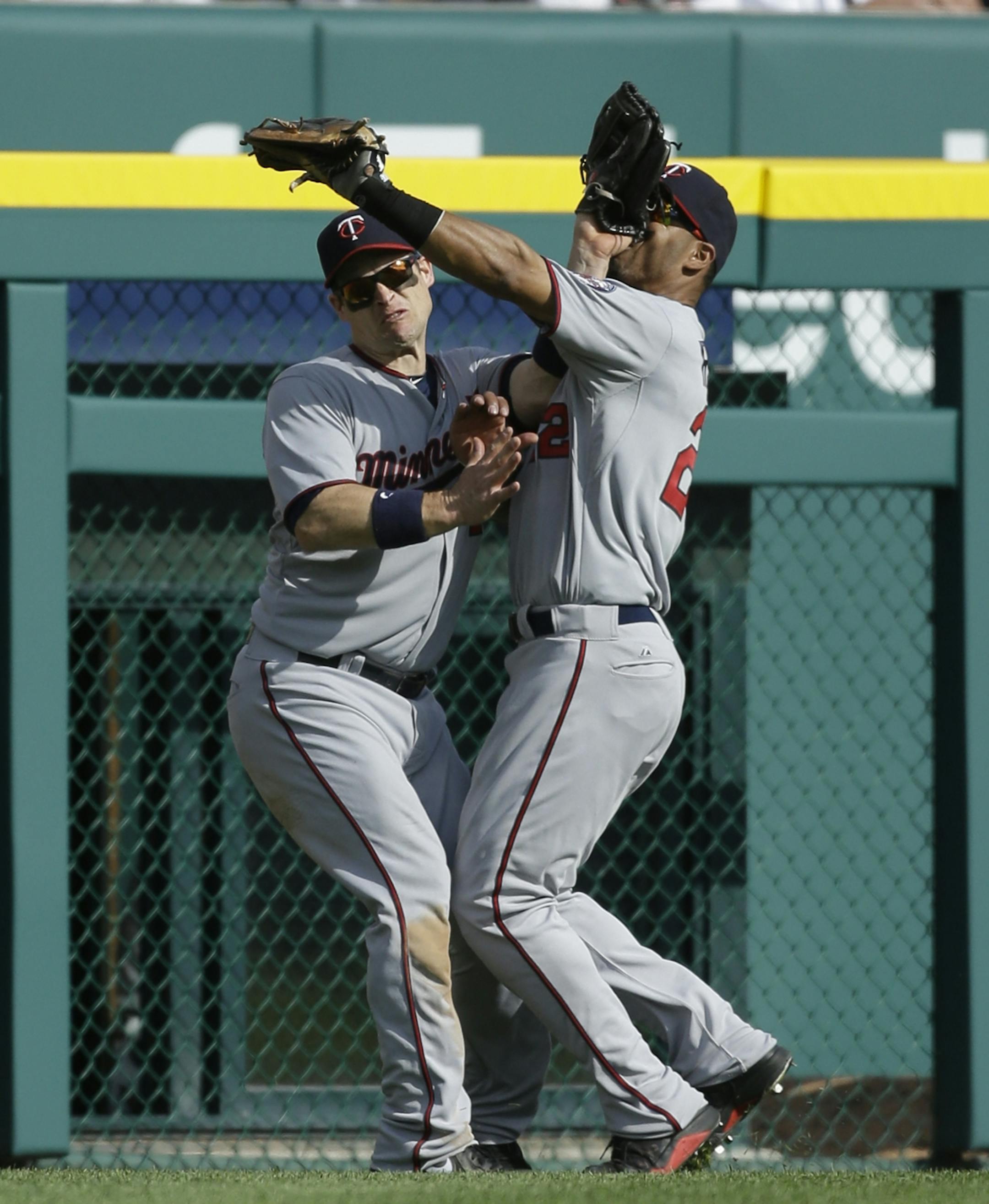 Twins center fielder Wilkin Ramirez, right, and left fielder Josh Willingham collided after chasing a fly ball hit by the Tigers' Omar Infante during the sixth inning Saturday.