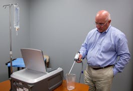 NxThera President Bob Paulson, shown operating a urological treatment device.