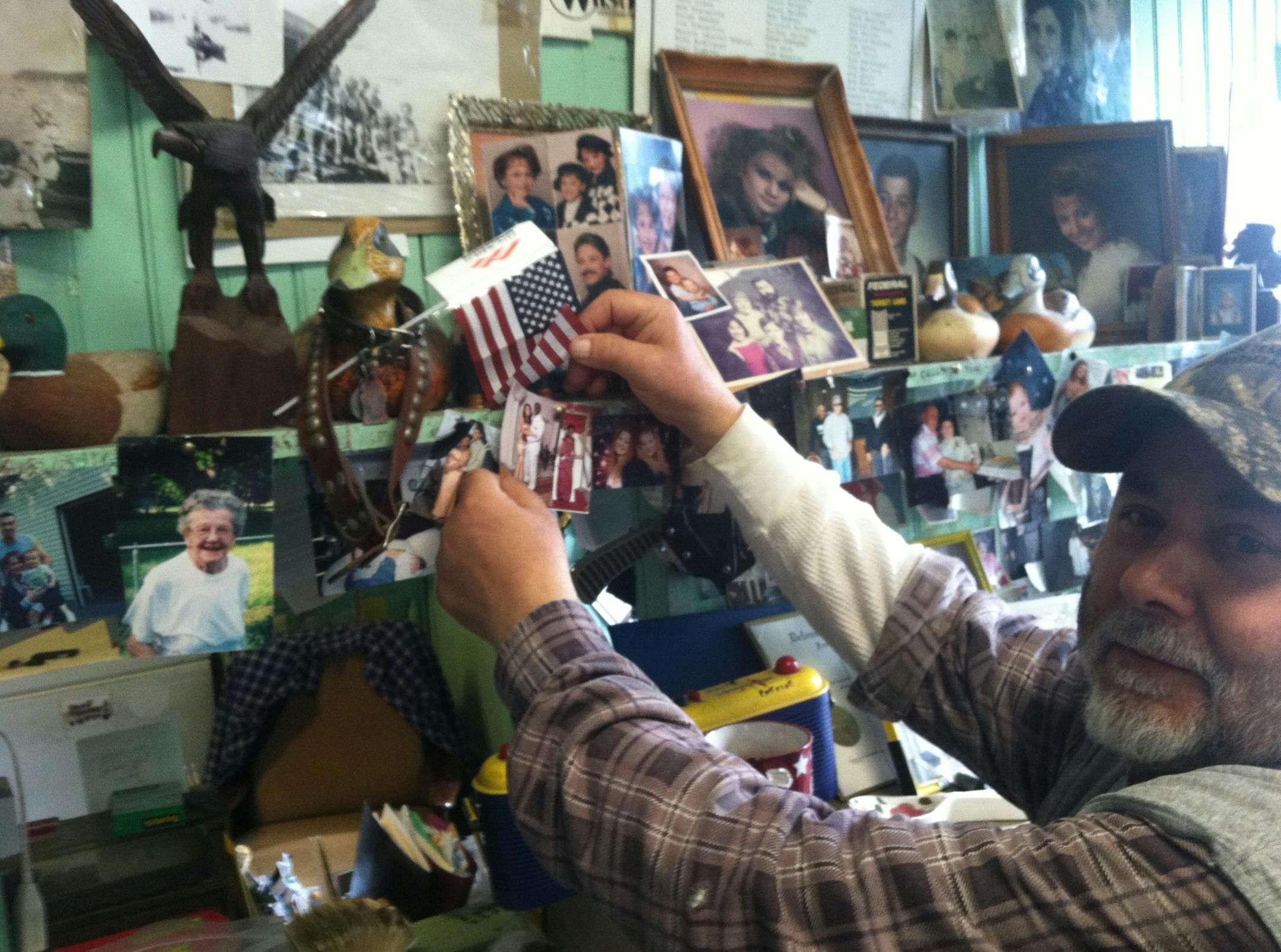 Photo by Chris Steller Behind Gene Joseph's meat counter, family photos are intermingled with pictures of customers, including several prom photos.