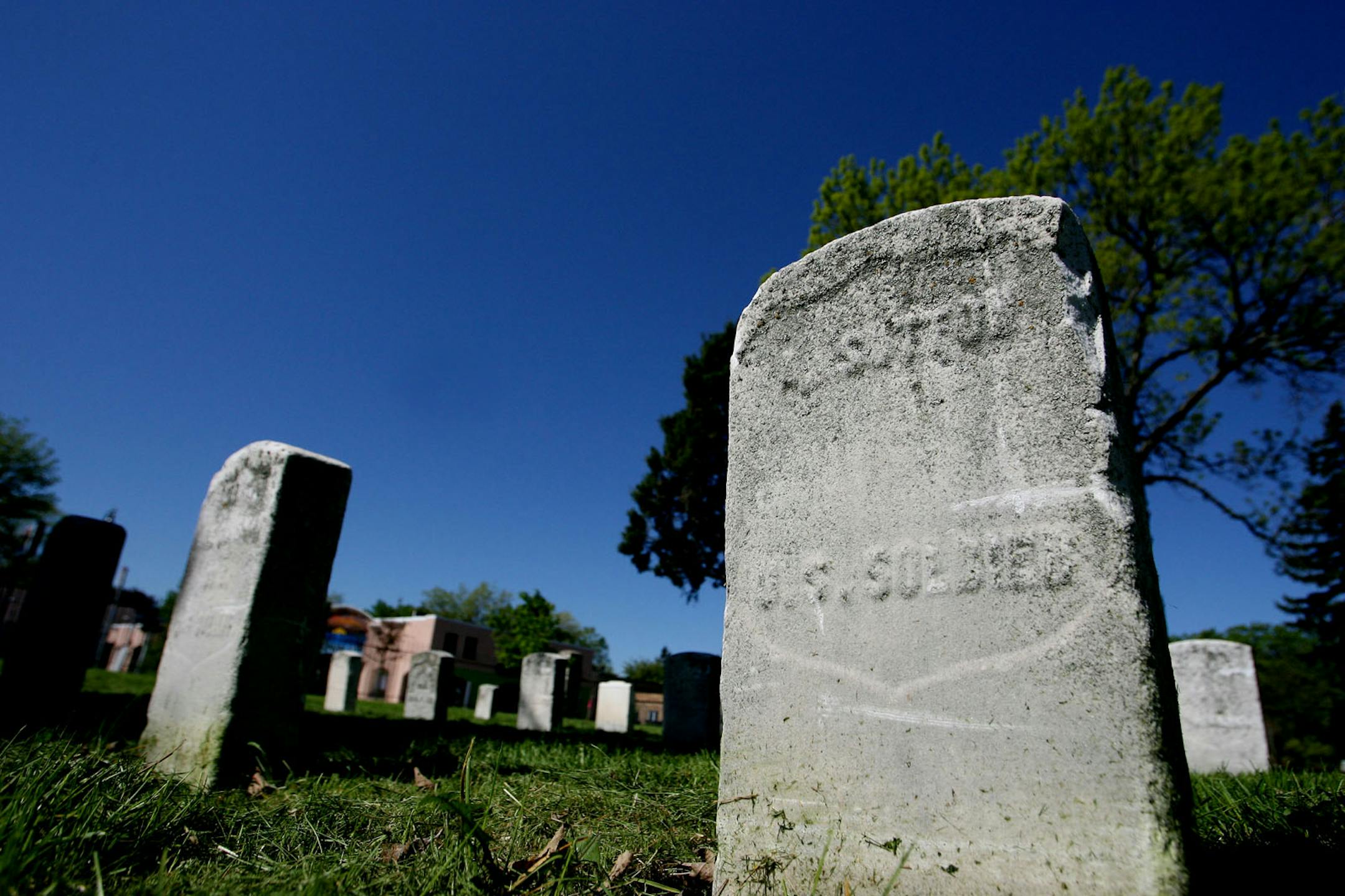 May 21, 2008 - Minneapolis, MN - The tombstones of Civil War veterans who were believed to be paupers, sit in a row on Layman's Cemetery, one of Minneapolis' oldest cemeteries. The words US Soldier are the only words inscribed on the tombstone.