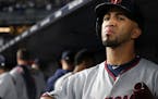 Minnesota Twins left fielder Eddie Rosario (20) looked to the scoreboard from the dugout after losing to the New York Yankees. ] ANTHONY SOUFFLE &#xef