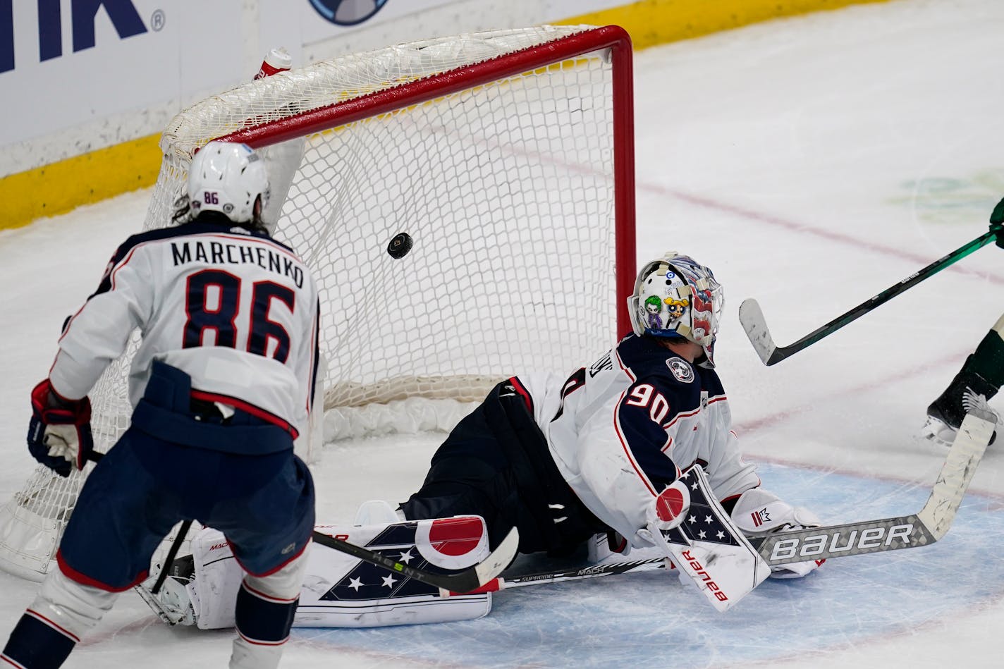 Columbus Blue Jackets goaltender Elvis Merzlikins (90), right, gives up the winning goal to Minnesota Wild left wing Kirill Kaprizov (not shown) during overtime of an NHL hockey game Sunday, Feb. 26, 2023, in St. Paul, Minn. (AP Photo/Abbie Parr)