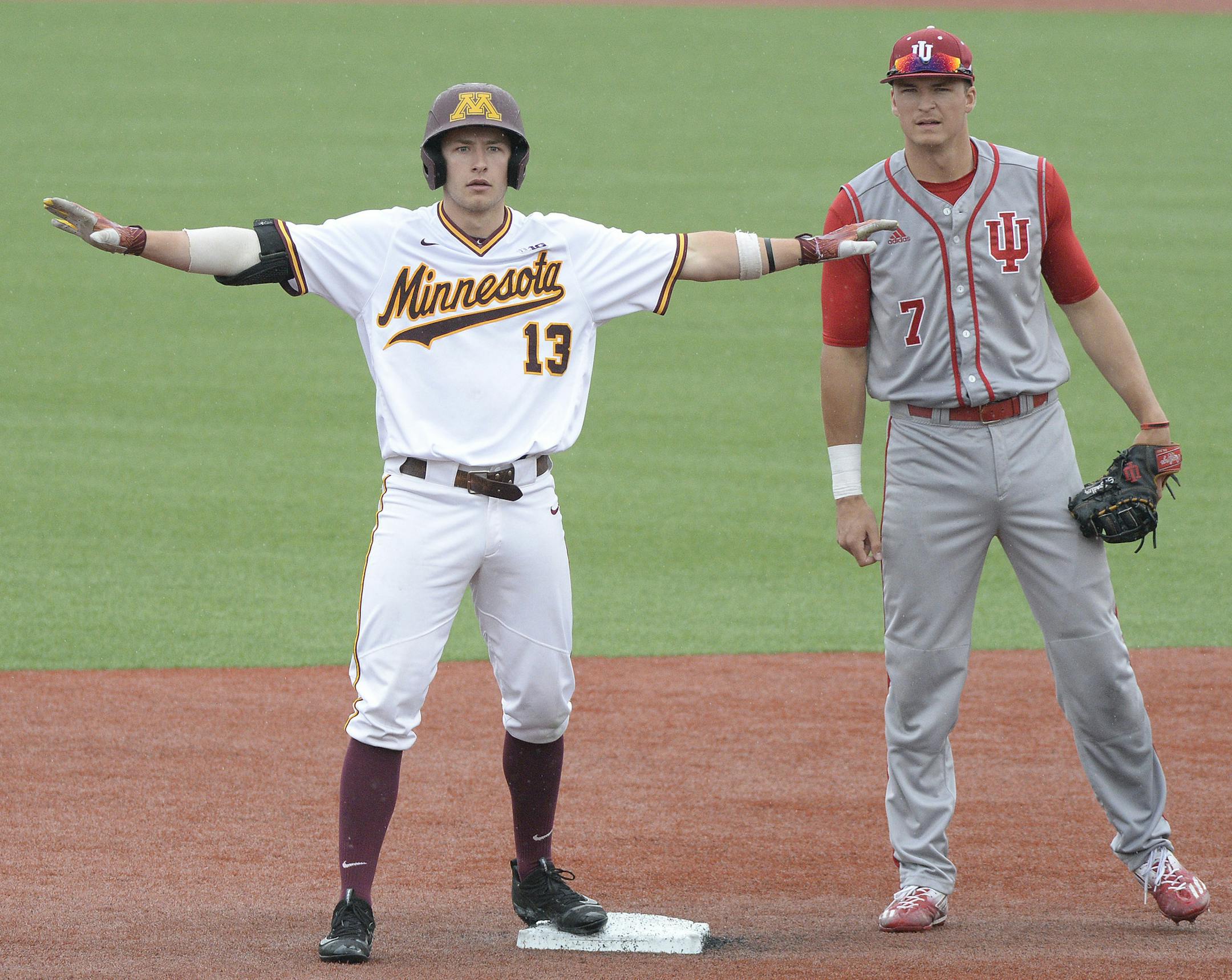 Chris Howell | Herald-Times
Indiana infielder Matt Gorski (7) looks on as Minnesota infielder Luke Pettersen (13) celebrates his double during the Indiana Minnesota Big Ten Baseball Tournament at Bart Kaufman Field in Bloomington, Ind. Wednesday, May 24, 2017. ORG XMIT: inbht101