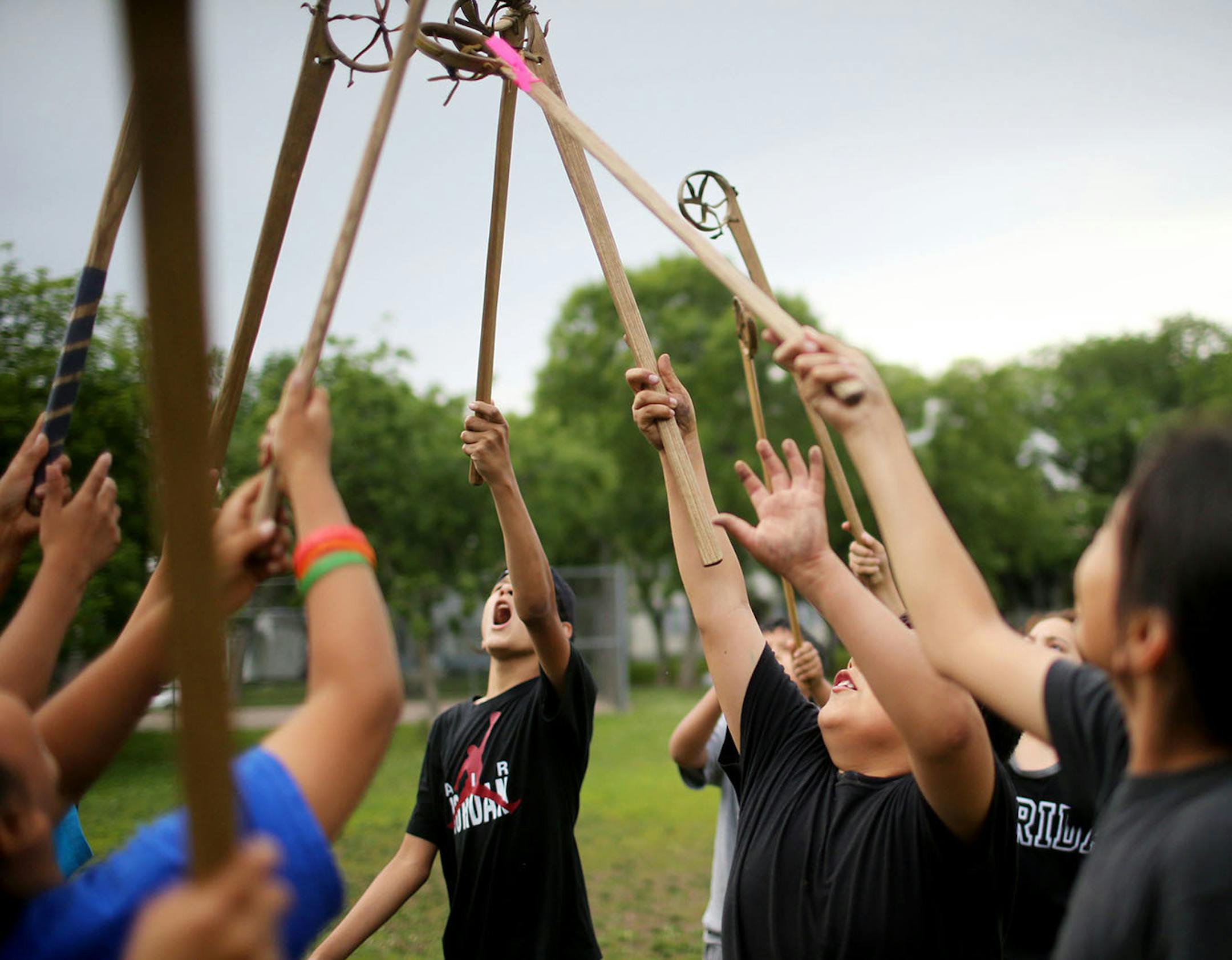 Youth boys team members of Twin Cities Native Lacrosse practice at Corcoran Park Wednesday, June 17, 2015, in Minneapolis, MN. The traditional Lacrosse players, who play with hand carved ash sticks, were preparing for the upcoming Twin Cities Native Lacrosse Tournament at the Osseo High School Saturday.