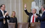 Attorney General Jeff Sessions, right, waves after speaking at the U.S. Marshals Service 37th Director's Honorary Awards Ceremony, at the Department o