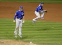 Chicago Cubs' Kris Bryant, left, and Addison Russell celebrate after Game 7 of the Major League Baseball World Series against the Cleveland Indians Th