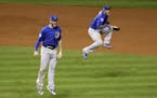 Chicago Cubs' Kris Bryant, left, and Addison Russell celebrate after Game 7 of the Major League Baseball World Series against the Cleveland Indians Th