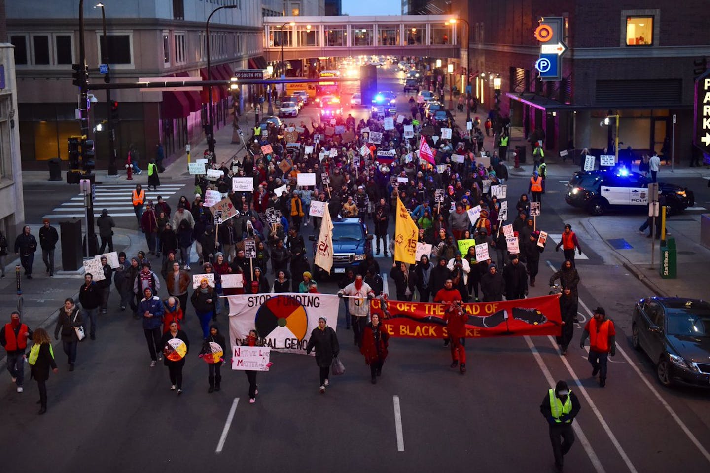 Protesters move toward City Hall in downtown Minneapolis Monday evening.