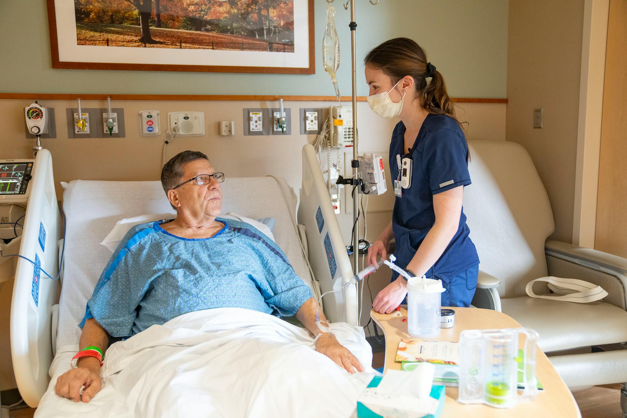Clay Tutland receives an injection from Danika Dahle, RN, Thursday, March 24, 2022 at Maple Grove Hospital in Maple Grove, Minn. Tutland received a left knee replacement at the hospital and is recovering.
