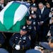Pallbearers carry the casket of New York City police officer Rafael Ramos following funeral services at Christ Tabernacle Church, in the Glendale sect