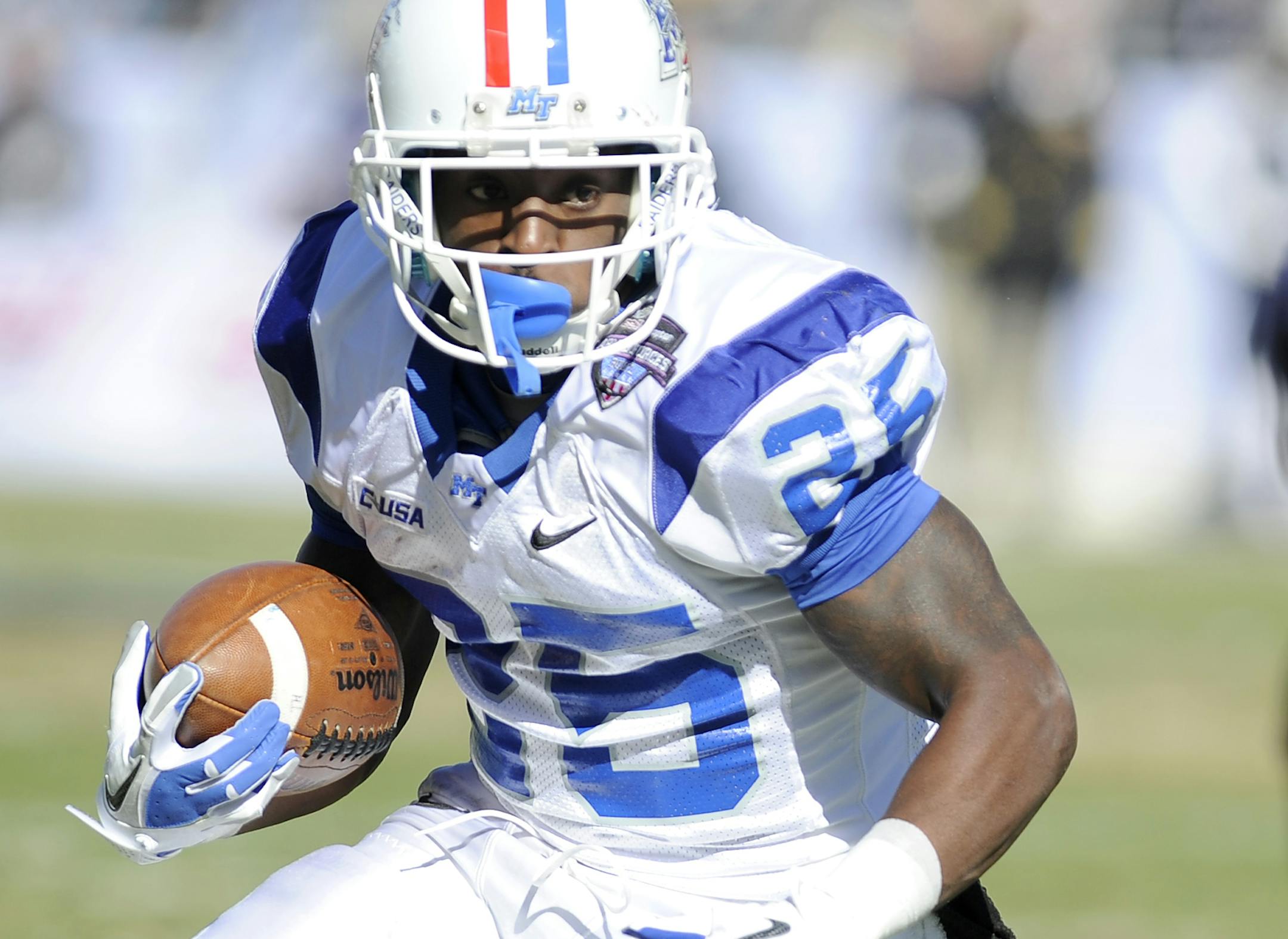 Middle Tennessee Blue Raiders running back Reggie Whatley (25) looks for running room in the first half during the Armed Forces Bowl NCAA college football game against the Navy Midshipmen, Monday, Dec. 30, 2013, in Fort Worth, Texas. (AP Photo/Matt Strasen) ORG XMIT: TXMS113