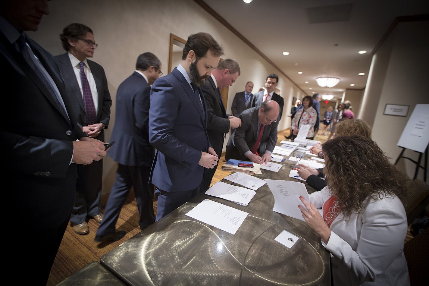 Activist investor Mick McGuire closed his hedge fund, Marcato Capital, after losses. File photo of McGuire checking into the Buffalo Wild Wings annual meeting in June 2017, when he won seats on the Golden Valley company's board of directors.