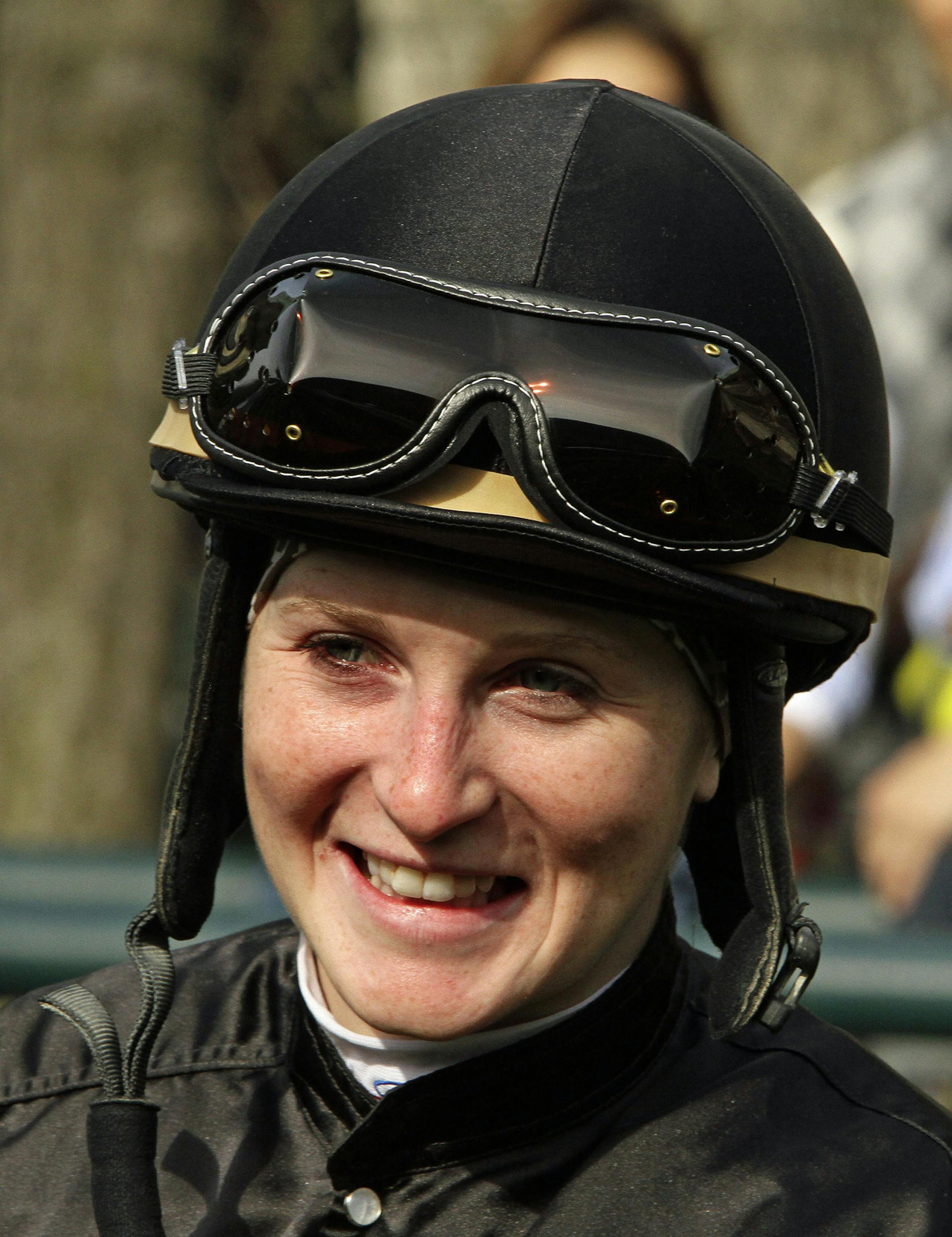 Jockey Rosie Napravnik waits for her mount in the paddock before a horse race at Keeneland Race Course in Lexington, Ky., Saturday, April 6, 2013. (AP Photo/Garry Jones) ORG XMIT: MIN2013042623002914