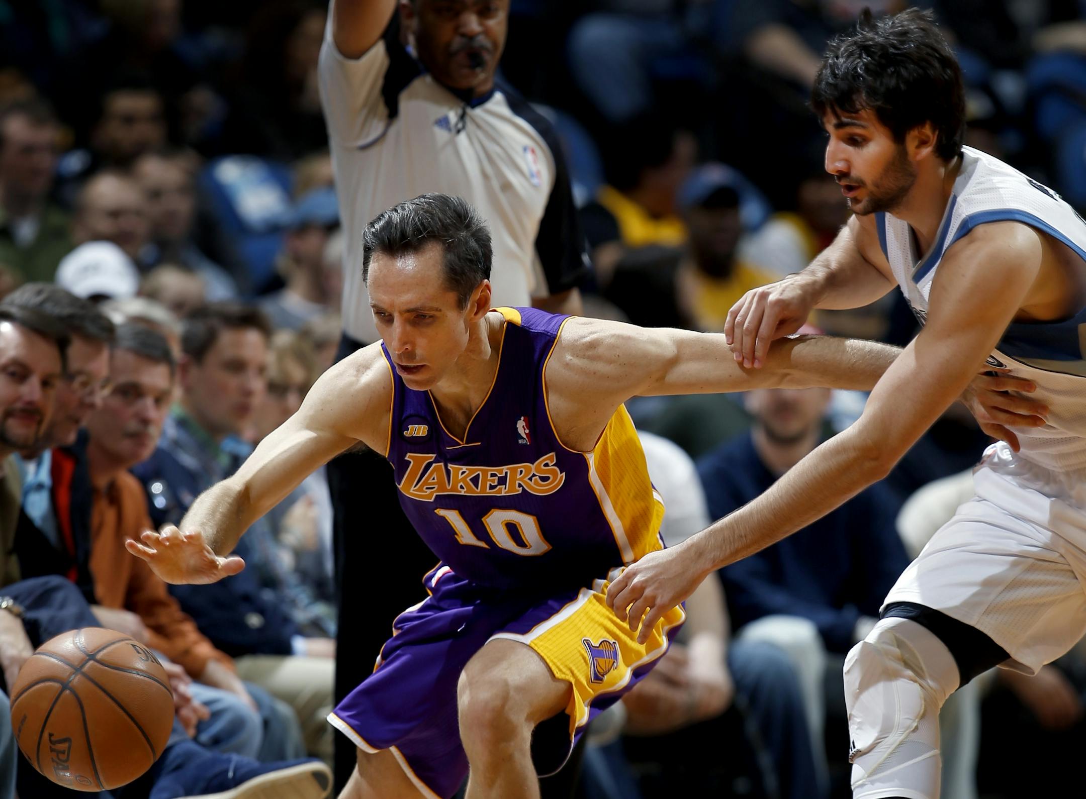 Steve Nash (10) was fouled by Ricky Rubio (9) in the first quarter.