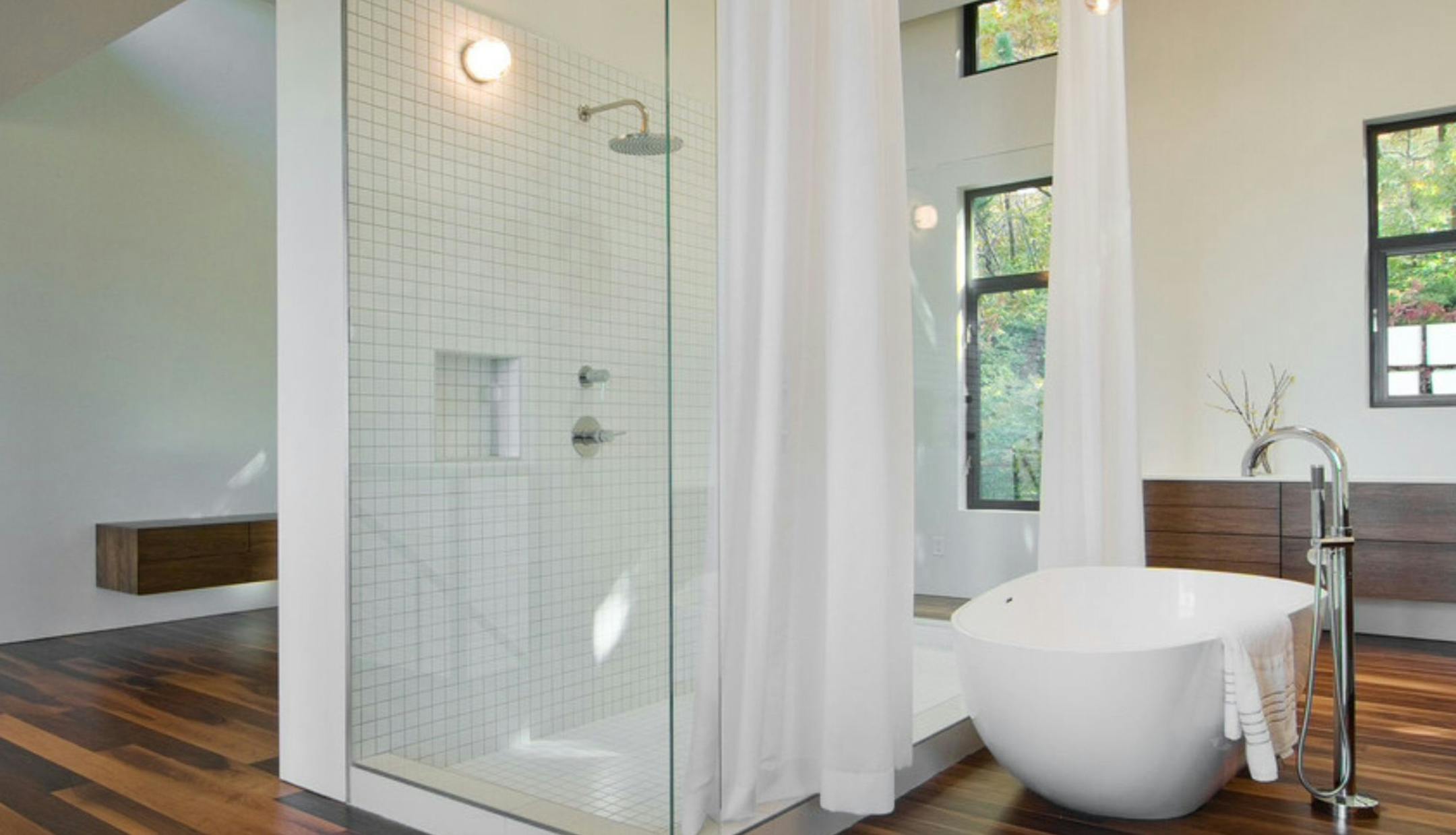 Houzz Bathroom with frameless glass shower and freestanding tub