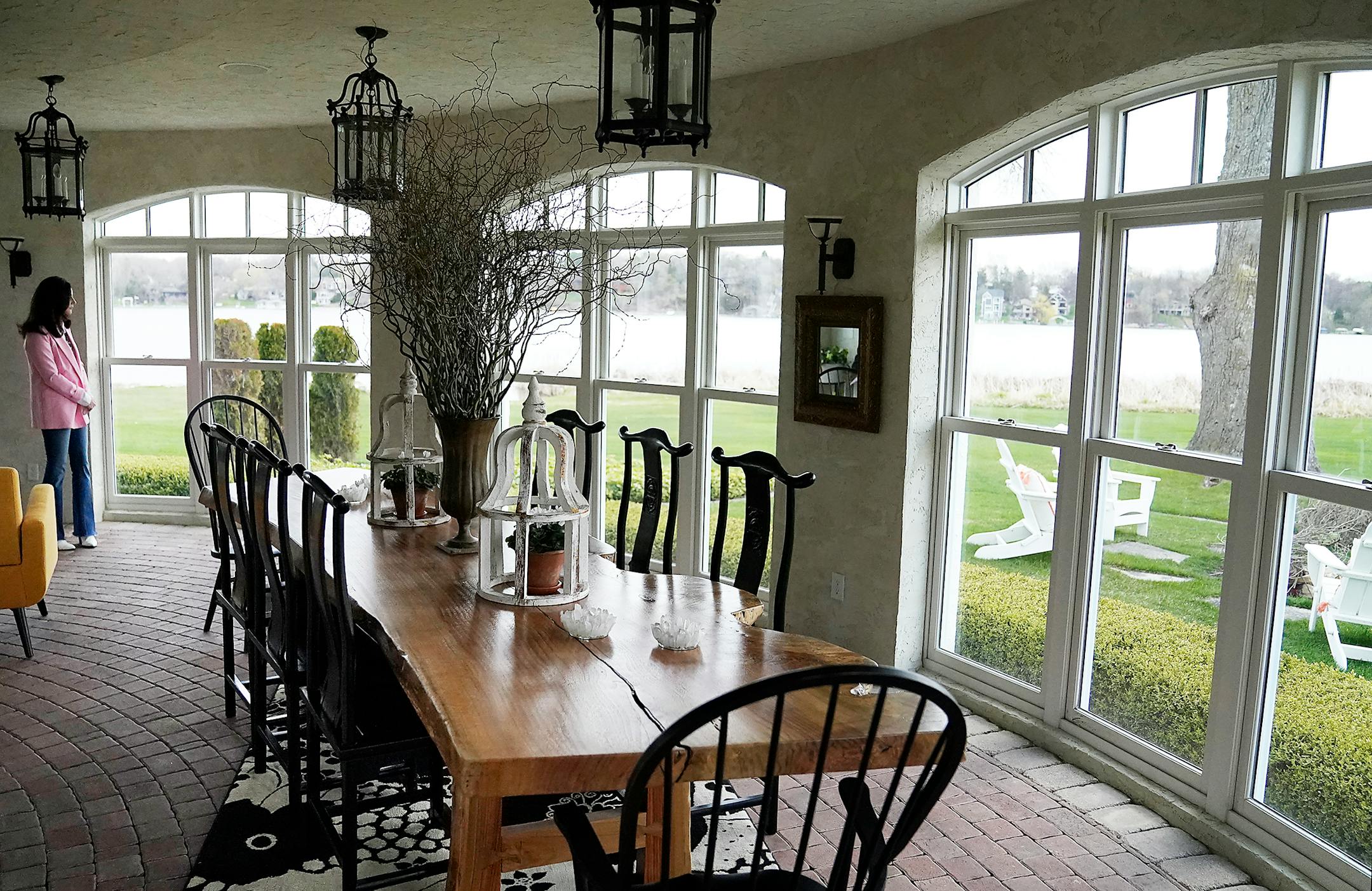 The enclosed wraparound porch on the lower level.