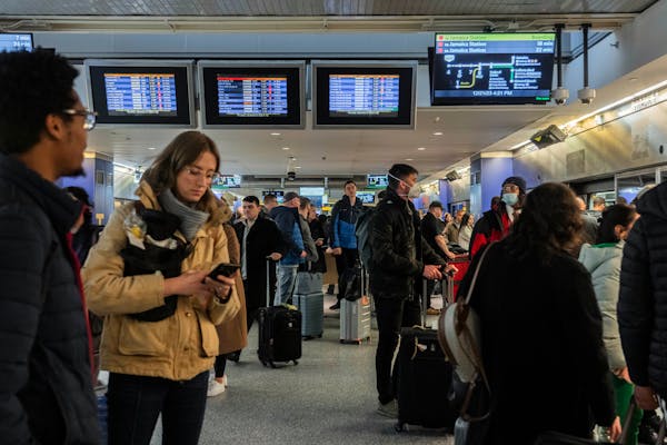 Christmas holiday travelers at John F. Kennedy Airport in Queens, New York, on Dec. 21, 2023. 